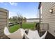 Relaxing back deck with cozy seating and views of the backyard and lake at 4561 Coles Dr, Columbus, IN 47201