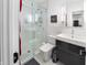 Modern bathroom features glass shower, sleek vanity, and a toilet with clean, white tile at 4561 Coles Dr, Columbus, IN 47201