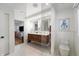 Contemporary bathroom with double sinks, modern fixtures, and a glass-enclosed shower at 4561 Coles Dr, Columbus, IN 47201