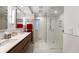 Modern bathroom with double sink vanity, glass shower, and a heated towel rack at 4561 Coles Dr, Columbus, IN 47201