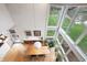 Dining area with large windows, natural light, and views of the lake and backyard at 4561 Coles Dr, Columbus, IN 47201