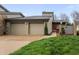 Charming home with a two-car garage, stone accents and well-manicured lawn at 4561 Coles Dr, Columbus, IN 47201