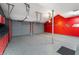 Well-organized garage features epoxy flooring and custom storage cabinets at 4561 Coles Dr, Columbus, IN 47201
