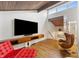 Living room with wood floors, vaulted wood ceiling, a TV, and modern furniture at 4561 Coles Dr, Columbus, IN 47201