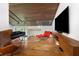 Modern living room with wood floors, a wood ceiling, and contemporary furnishings at 4561 Coles Dr, Columbus, IN 47201
