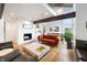 Bright living room featuring a fireplace, modern furniture, wood flooring and large windows at 4561 Coles Dr, Columbus, IN 47201