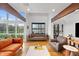 Bright living room with hardwood floors, exposed beams and beautiful lake views at 4561 Coles Dr, Columbus, IN 47201