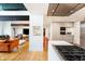 Open concept, with view of the kitchen, featuring modern appliances, sleek cabinetry, and hardwood floors at 4561 Coles Dr, Columbus, IN 47201