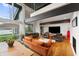 Open living and dining area with floor-to-ceiling windows and stylish decor at 4561 Coles Dr, Columbus, IN 47201