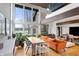 Open living and dining area with lake views, hardwood floors and stylish decor at 4561 Coles Dr, Columbus, IN 47201