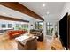 Bright living room with hardwood floors, exposed beams and beautiful lake views at 4561 Coles Dr, Columbus, IN 47201