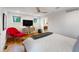 Bedroom with wood floors, ceiling fan, and television, with access to the bathroom at 4561 Coles Dr, Columbus, IN 47201