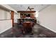 Open basement featuring bar, foosball table, and stylish flooring for a perfect entertainment space at 4777 Madras Ct, Zionsville, IN 46077