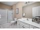 Bright bathroom with a glass-enclosed shower, white vanity, and neutral décor, offering a clean and fresh look at 4777 Madras Ct, Zionsville, IN 46077