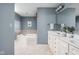 Bathroom showcasing a built-in tub and double vanity with great storage space at 4777 Madras Ct, Zionsville, IN 46077