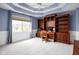 Large bedroom with custom wood built-ins perfect for a home office setup at 4777 Madras Ct, Zionsville, IN 46077