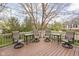 Spacious outdoor deck with four swivel chairs, small tables, and string lights overhead for relaxing evenings at 4777 Madras Ct, Zionsville, IN 46077