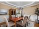 Dining room with elegant chandelier, wainscoting, and classic decor at 4777 Madras Ct, Zionsville, IN 46077