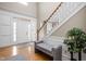 Bright foyer with high ceilings, hardwood floors, staircase, and decorative molding at 4777 Madras Ct, Zionsville, IN 46077
