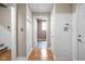 Bright hallway with hardwood floors, wainscoting and leading to other rooms at 4777 Madras Ct, Zionsville, IN 46077