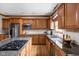 Spacious kitchen featuring stainless steel appliances, granite countertops, and custom cabinetry at 4777 Madras Ct, Zionsville, IN 46077