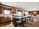 Open kitchen with granite counters, stainless appliances, and adjacent dining and living areas at 4777 Madras Ct, Zionsville, IN 46077