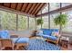 Inviting sunroom with ample windows, comfortable seating, and decorative plants, perfect for relaxation at 4777 Madras Ct, Zionsville, IN 46077