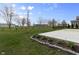 Expansive backyard featuring a concrete patio and lush green lawn, perfect for outdoor gatherings at 4831 E Oak Hill E Dr, Lebanon, IN 46052