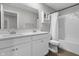 Modern bathroom features a double sink vanity, a large mirror, and a bathtub-shower combo for ultimate comfort at 4831 E Oak Hill E Dr, Lebanon, IN 46052