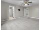 Spacious bedroom features neutral walls, plush carpeting, and a ceiling fan, creating a serene and inviting atmosphere at 4831 E Oak Hill E Dr, Lebanon, IN 46052