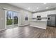 Open concept kitchen and sliding glass doors to the backyard at 4831 E Oak Hill E Dr, Lebanon, IN 46052