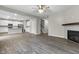 Open-concept living room with modern fireplace and vinyl plank flooring at 4831 E Oak Hill E Dr, Lebanon, IN 46052