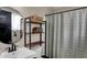 Bathroom featuring a round mirror and open shelving at 500 N Shellbark Rd, Muncie, IN 47304