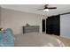 Bedroom featuring a modern sliding barn door closet and soothing color palette at 500 N Shellbark Rd, Muncie, IN 47304