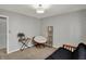 Bedroom featuring a futon and light neutral colors at 500 N Shellbark Rd, Muncie, IN 47304