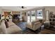 Comfortable living room with a large sectional, TV, modern decor, and plenty of natural light at 500 N Shellbark Rd, Muncie, IN 47304