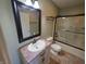 Bathroom featuring a vanity with tile countertop, a mirror, and a shower at 52 Spring Lake Ct, Trafalgar, IN 46181