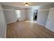 Spacious bedroom featuring wood flooring and a window with natural light at 52 Spring Lake Ct, Trafalgar, IN 46181