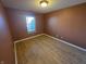 Bedroom featuring hardwood floors and a window bringing in natural light at 52 Spring Lake Ct, Trafalgar, IN 46181