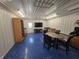 Finished garage or flex space with kitchenette, dining table and epoxy floors at 52 Spring Lake Ct, Trafalgar, IN 46181