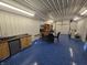 Finished garage with kitchenette, epoxy floors, and ample storage space at 52 Spring Lake Ct, Trafalgar, IN 46181