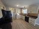 Well-lit kitchen with stainless appliances, contrasting countertops, and decorative backsplash at 52 Spring Lake Ct, Trafalgar, IN 46181