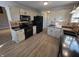 Bright kitchen with stainless appliances, decorative tile backsplash and modern fixtures at 52 Spring Lake Ct, Trafalgar, IN 46181