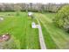 An expansive lot featuring multiple storage sheds and a potential building site surrounded by lush green grass at 5301 Old Smith Valley Rd, Greenwood, IN 46143