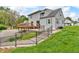The backyard features a well-maintained lawn, patio, and wooden deck, perfect for outdoor relaxation at 5301 Old Smith Valley Rd, Greenwood, IN 46143