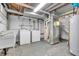 Spacious basement featuring a washer, dryer, utility sink, and furnace; perfect for laundry and storage at 5301 Old Smith Valley Rd, Greenwood, IN 46143