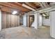 Unfinished basement with exposed ceiling beams and concrete floor at 5301 Old Smith Valley Rd, Greenwood, IN 46143