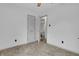 Cozy bedroom with a closet featuring neutral walls, plush carpet, and simple, functional decor at 5301 Old Smith Valley Rd, Greenwood, IN 46143