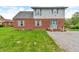 Two-story home featuring brick accents, a light blue door, and light blue shutters at 5301 Old Smith Valley Rd, Greenwood, IN 46143