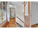 Traditional style hallway with wood trim, carpeted stairs and large window at 5301 Old Smith Valley Rd, Greenwood, IN 46143